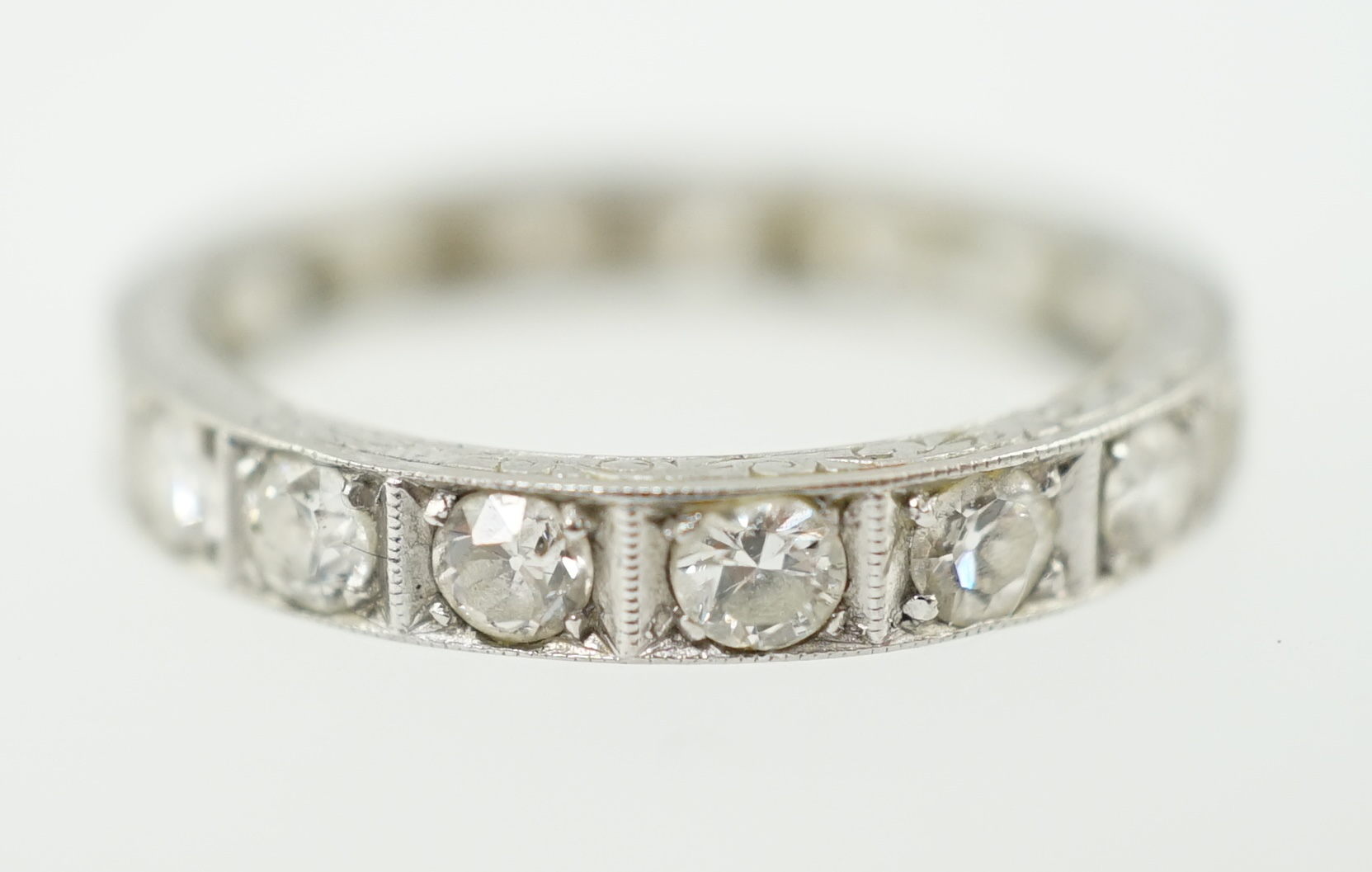 A mid 20th century platinum and diamond set full eternity ring